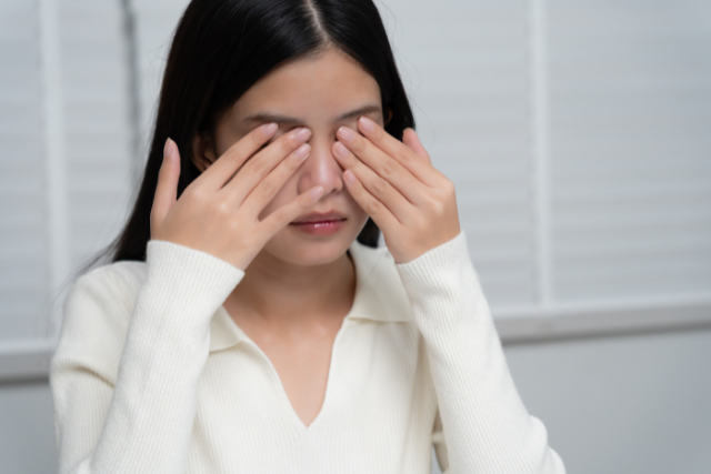 rubbing strained eyes